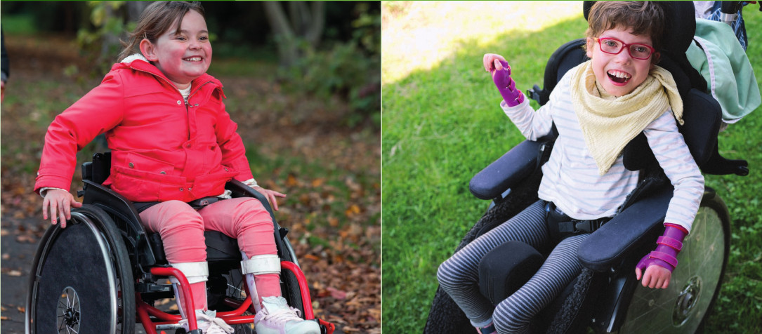 2 children in wheelchairs having fun